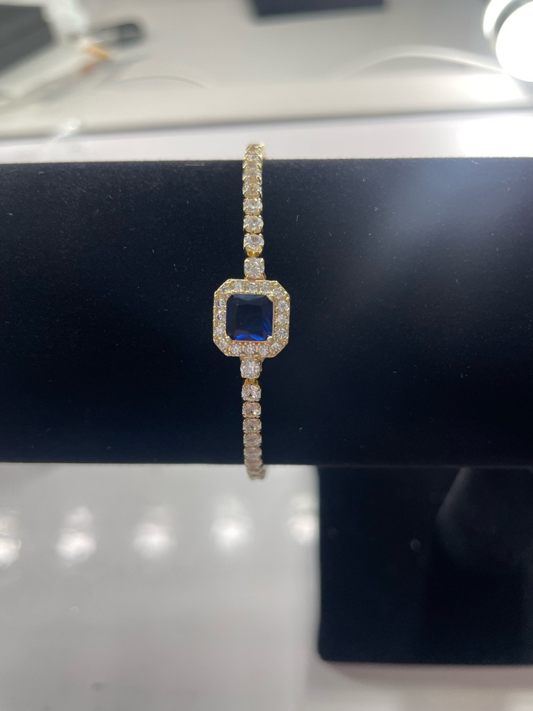 18k Gold Tennis Bracelet With Blue Sapphire Center Stone